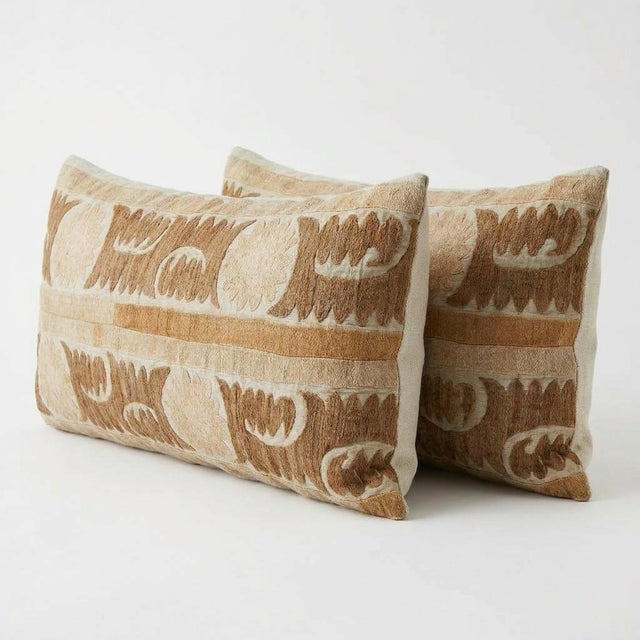 This beautiful 16'' x 36'' & 17'' x 36'' hand-embroidered Suzani pillow cover set was made from authentic Uzbek cotton...