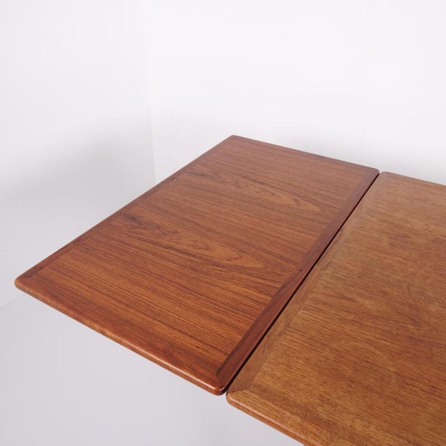 Dining table designed by hans j. Wegner and manufactured by andreas tuck in denmark. The table is crafted with a teak...