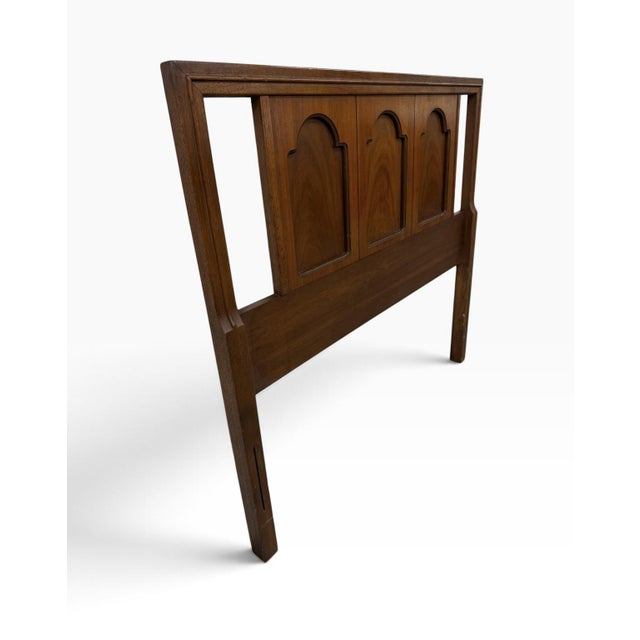 This Mid-Century Modern Twin Size Walnut Headboard is a piece of antique furniture from the mid 20th century, specifically...