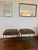 A striking pair of vintage Ethan Allen stools, restored and newly upholstered in black-and-gold tiger-print chenille. The...