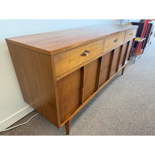 Mid Century Modern 9 drawer by Basic Witz of Waynesboro, Virginia. The piece features nine dovetailed drawers with a...