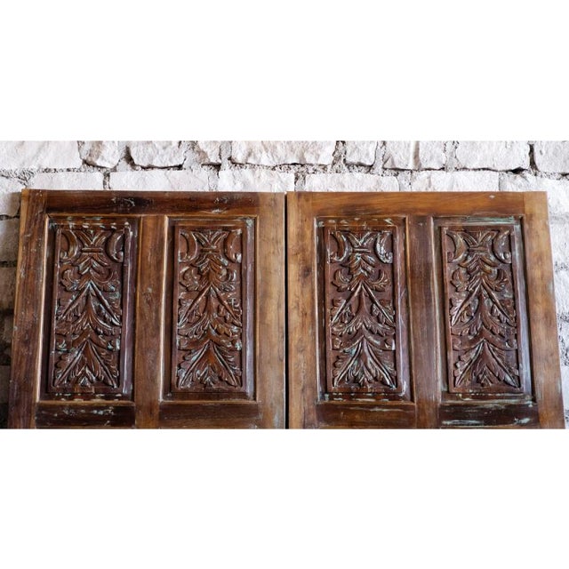 Add timeless rustic charm to your interiors with this hand-carved reclaimed wood door panel, a striking blend of farmhouse...