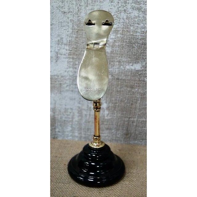 A Rare W.Potter & Sons Victorian Brass Shoe Display Stand. Made from brass mounted on a terracotta base with a black...