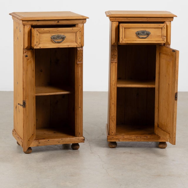 Pair of late 19th century Hungarian tall nightstands or small cabinets, crafted in pine with a warm patina developed...