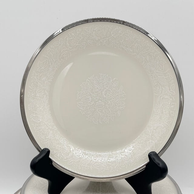 A beautifully restrained take on traditional Lenox, this vintage Moonspun dinnerware set layers intricate white botanical...
