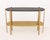 Luxxu "Craig" Black Marble Top Two-Tier Brass Console Table. 33.5" H x 48.25" W x 13.25" D. Provenance: From a Fifth...