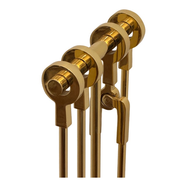A rare all-brass fireplace tool set attributed to Danny Alessandro, renowned for his sculptural, modernist Mid-Century...