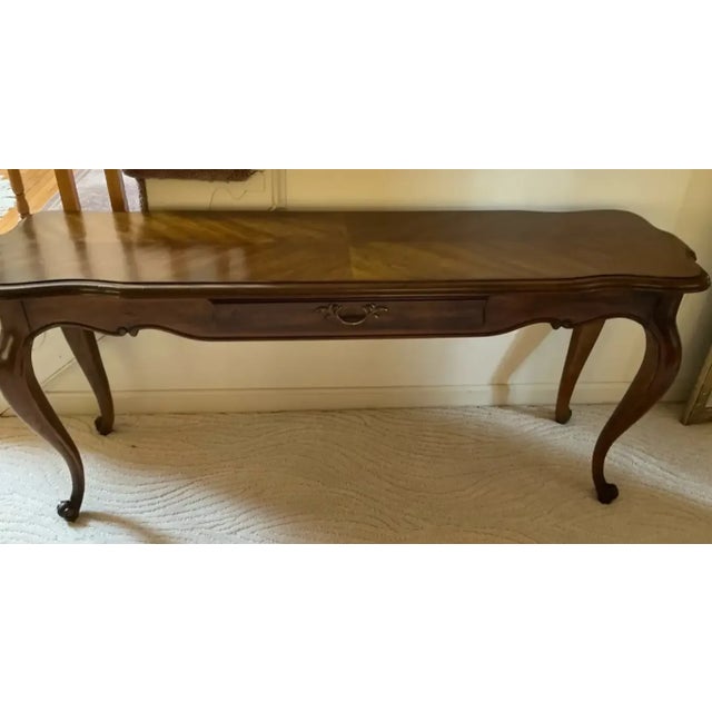 Elegant vintage Drexel Heritage sofa table / console table in a French Provincial / Queen Anne revival style, circa...