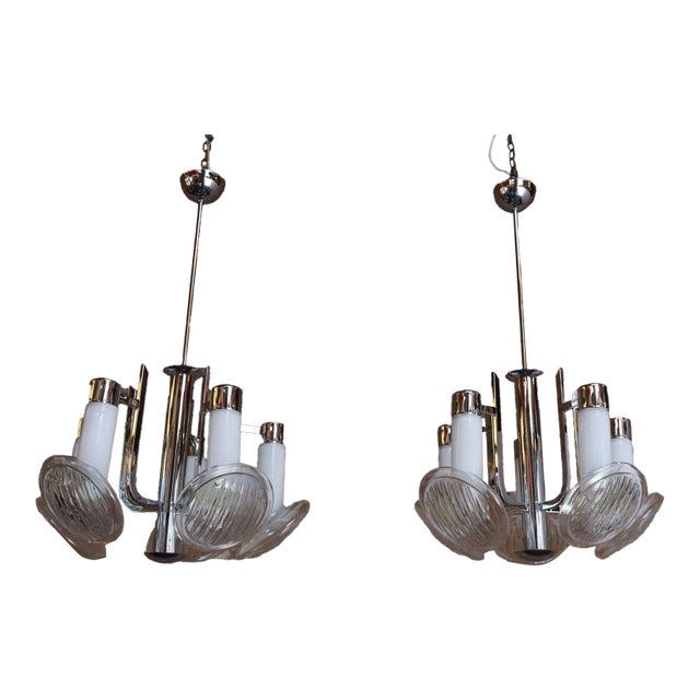 Pair of by chandeliers by Carlo Nason for Mazzega - each fixture composed of a chrome central structure whose branches...