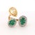 This contemporary ring is crafted in 14K yellow gold. It features a striking oval green emerald, weighing approximately...