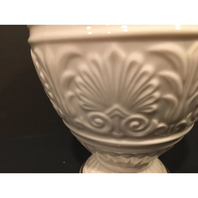 From the Lenox China Athenian Collection, this sculpted cream vase is highlighted with gold bands at the base and the rim....