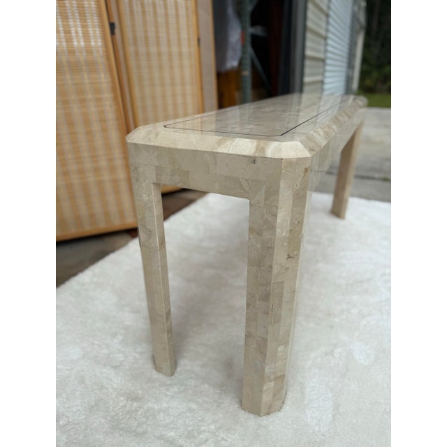 Vintage Maitland-Smith console table in tessellated stone with a refined cream and bone finish. A timeless design that...