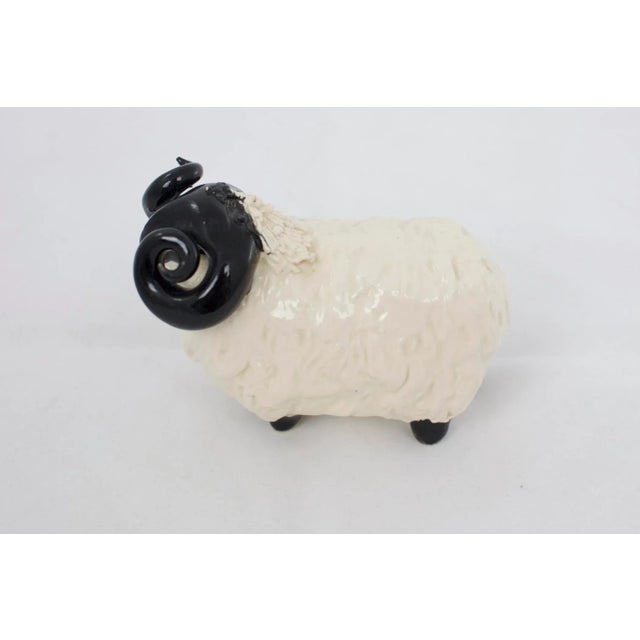 Handmade ceramic ram figure. Signed and numbered, markings illegible.