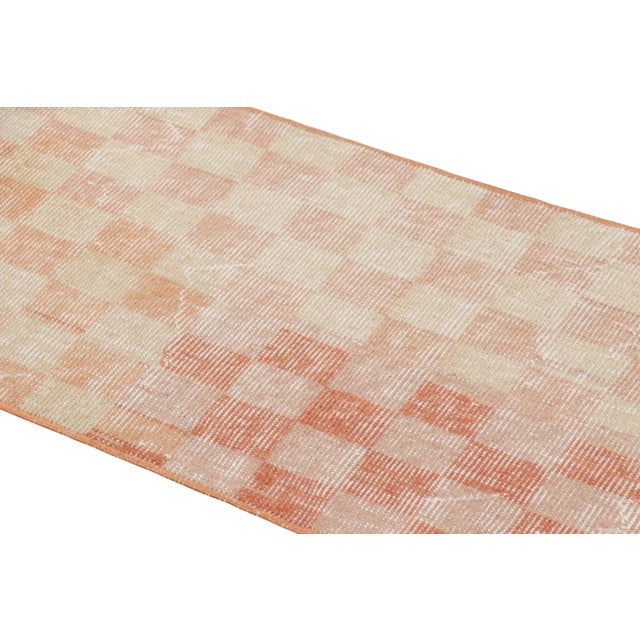 Hand-knotted in wool and originating from Turkey circa 1960 – 1970, this 1x6 vintage Zeki Müren runner is a unique...