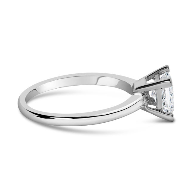 Embodying elegance and the promise of a beautiful future, this 14K white gold engagement ring captures hearts with its...