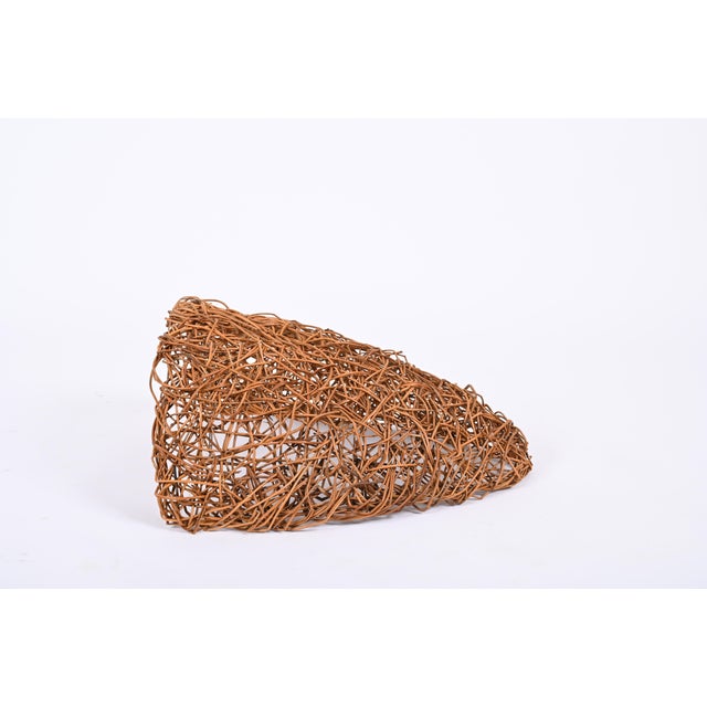 Wonderful pair of midcentury rattan nesting wall lamps. This set was designed in Italy during the 1970s. This set is...