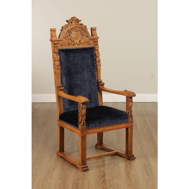 High Quality Carved Wood Throne Armchair Featuring A Tall Upholstered Back And Seat In Dark Blue Fabric, Set Within A...