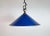 Industrial blue enamel factory pendant light made in United Kingdom during the 1950s. White enamel inside the shade. Brass...