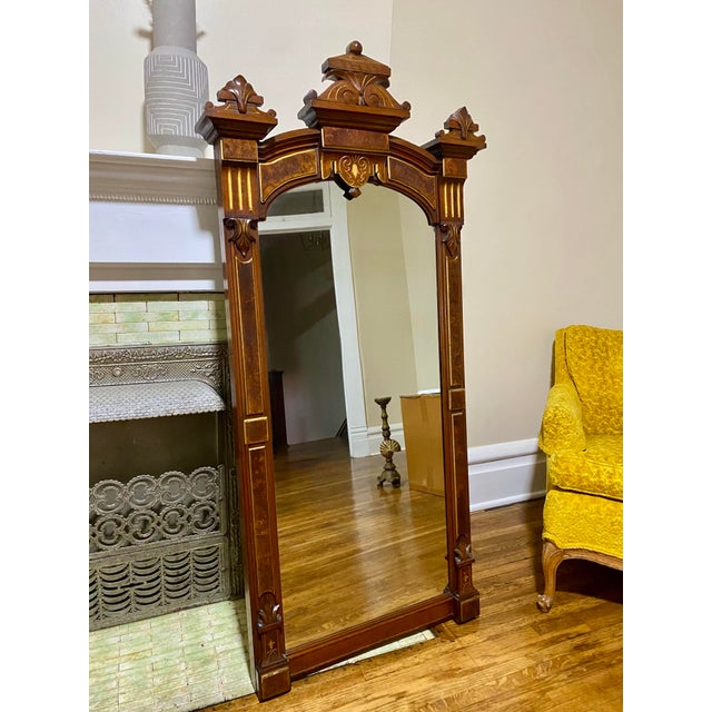 Excellent condition! Gorgeous Victorian style wall mirror featuring an arched carved wood frame with decorative gilt...