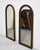 Elegant and dramatic, this pair of 1970s Hollywood Regency wall mirrors blends neoclassical design with the rich texture...