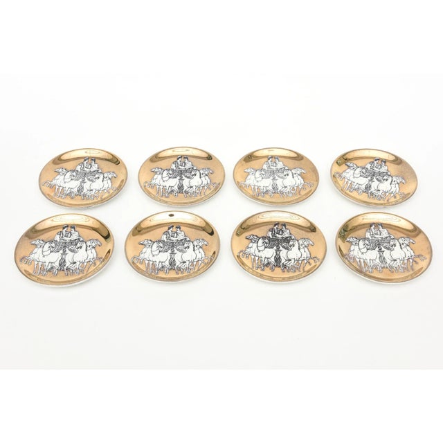 These vintage Italian Piero Fornasetti gilded porcelain coasters are from the 60's. They retain their original box that...