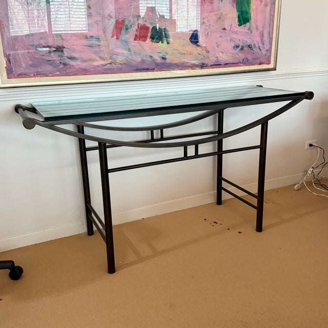 Post Modern Iron Console Table A late 20th century iron console table with a distinctive, graphic frame and thick glass...