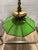 A striking vintage pendant chandelier pairing rich green glass with substantial brass construction. Eight glass panels...