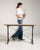 A classic French café table combining a cast iron base with a wooden top, reflecting the enduring design of Parisian...
