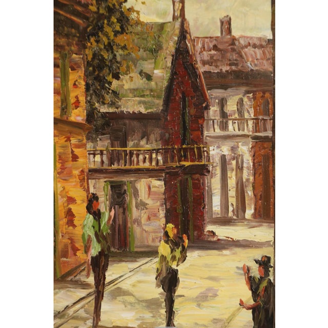 Original oil on canvas of a street scene framed in a beautiful gilded frame. In perfect condition.