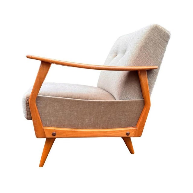 This lounge chair is a beautiful example of European modernist design from the mid-20th century. with its elegant...