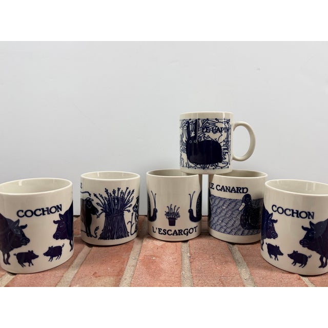 This set of six Taylor & Ng mugs, part of their highly collectible ‘Vintage French’ collection, includes: 2 x Cochon...