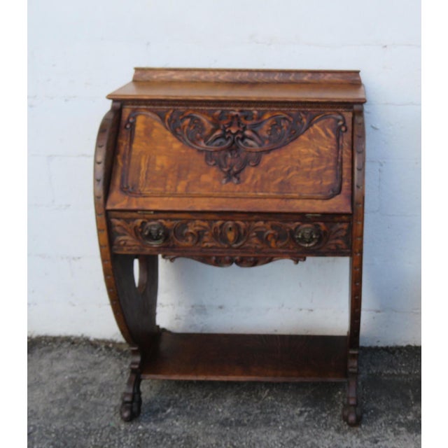 This Secretary Desk is made out of wood, solid wood, oak, tiger oak, and veneer. This Secretary Desk has Gothic style...