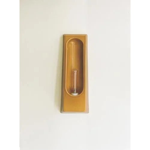 Alcove ouro wall lamp by violaine d'harcourt dimensions: d 7 x w 12 x h 33 cm. Materials: ceramic. Wall light made in...