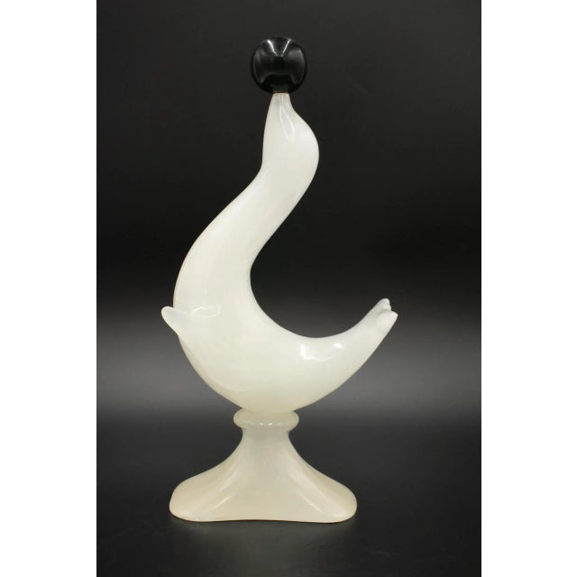 Large vintage white agate statue of a sea lion balancing a black ball on its nose. 14 inches tall, with a width of 7...