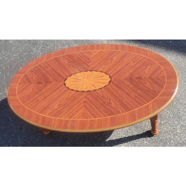 A Late 20th Century Bookmatched Mahogany and Satinwood Inlaid style and twisted legs coffee table. It measures 44" in...