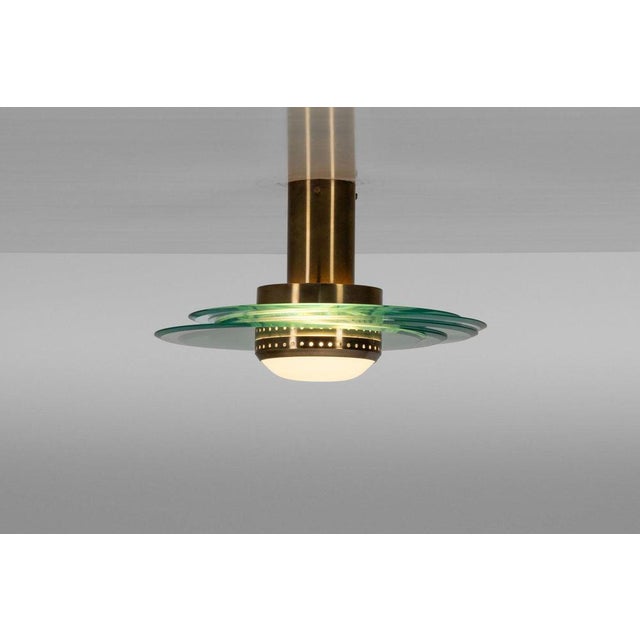 A rare set of two ceiling lamps, model 2079, designed by Max Ingrand and produced by Fontana Arte in Italy around 1960....