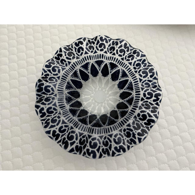 Here are two charming candy dishes with ruffled edged. One cobalt blue and the other midnight black. They measure 7"...