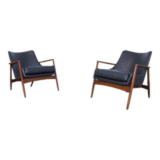 Danish Modern Black Leather and Walnut Lounge Chairs by Ib Kofod Larsen for Selig For Sale