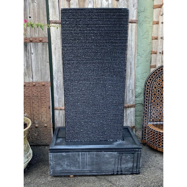 Beautiful slate gray cement ripple wall fountain. Includes pump and ready to plug in to your existing electrical outlet....