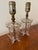 Sweet pair of petite table lamps made from antiqued glass. Details include etched florals and scalloped top. Pair these...