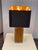 Design Plus Gallery presents the Spike Table Lamp from J. Alexander Lighting. The rectangular gold-tone column is covered...