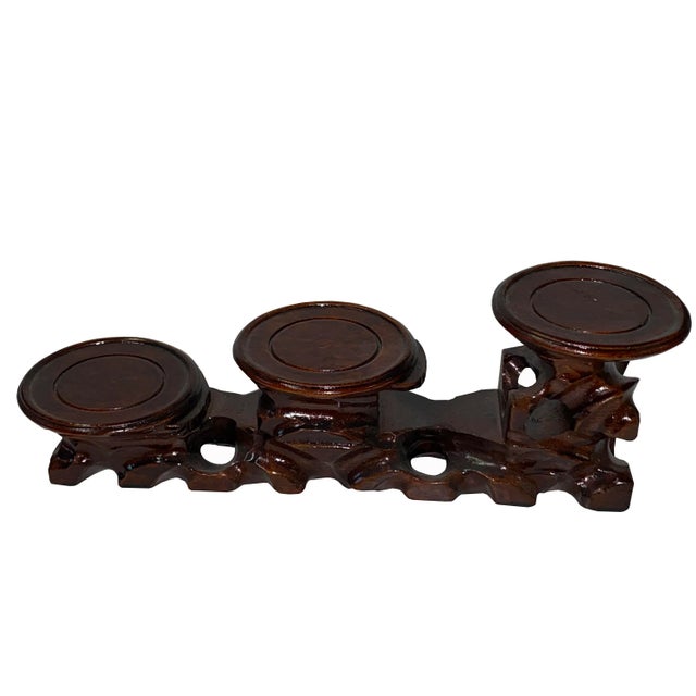 This is a nice dark brown color wood quality small display stand in a rectangular shape with 3 round platforms. It is a...