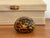 Italian Murano style art glass paperweight with an orange and black pattern reminiscent of leopard print. Most items found...