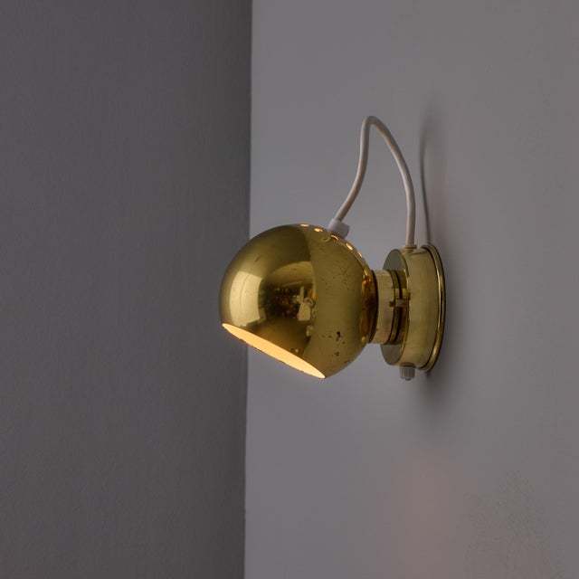 Pair of 1970s Goffredo Reggiani 'Eyeball' Adjustable Perforated Metal Wall Lamps Executed in brass metal with perforations...
