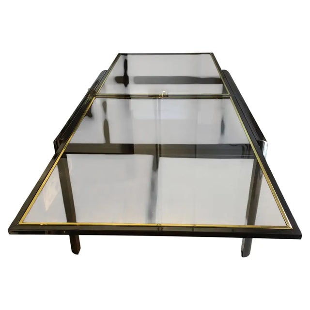 Mid‑Century Modern extendable dining table by DIA — Design Institute of America, featuring the brand’s signature sleek...