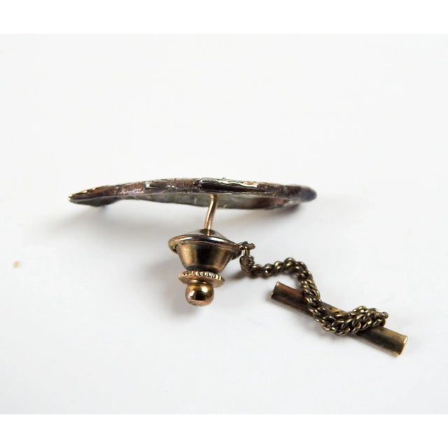 Late 20th century sculptural trout or salmon fish tie tack. No markings, but looks to be artist studio made, cast silver...