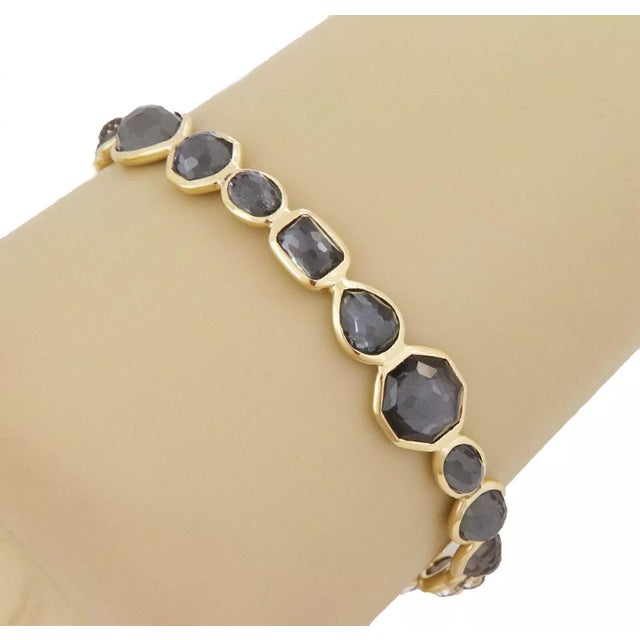 This gorgeous authentic bangle is by Ippolita from the Rock Candy Gelato Collection. It is crafted from 18k yellow gold...