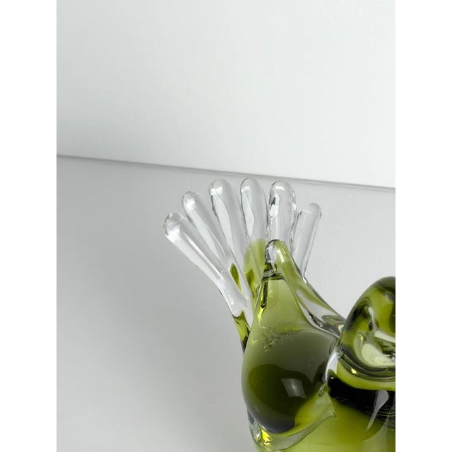 A 1960s Murano glass dove sculpture by Seguso Vetri d'Arte, worked in clear, chartreuse green and near-black glass. The...