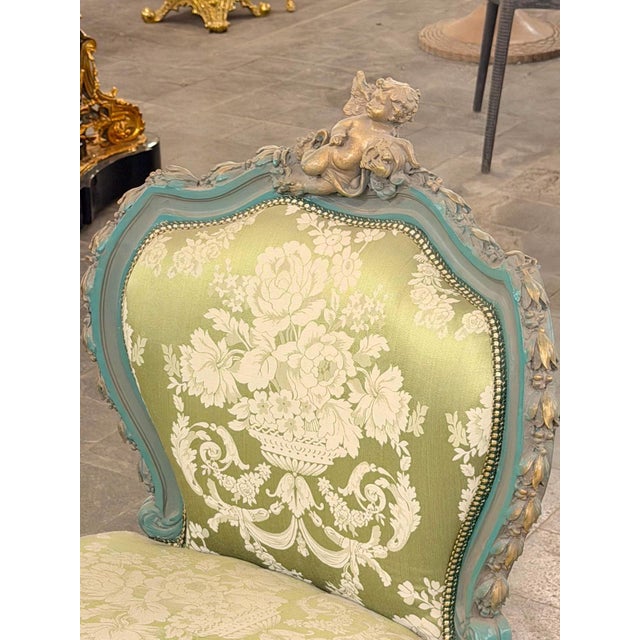A charming vintage-style French Louis XV double-ended settee / window bench, finished in a soft sage-green tone with...