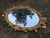 1960s Vintage Gold Resin Framed 40” Large Oval Wall Mirror French Rococo Hollywood Regency Style For Sale - Image 5 of 10